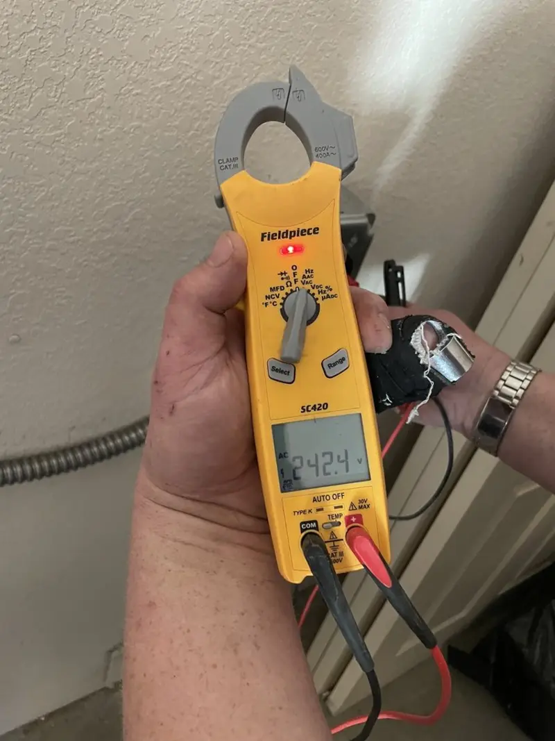 Voltage testing with clamp meter during Recessed Lighting Installation in Sunset Hills